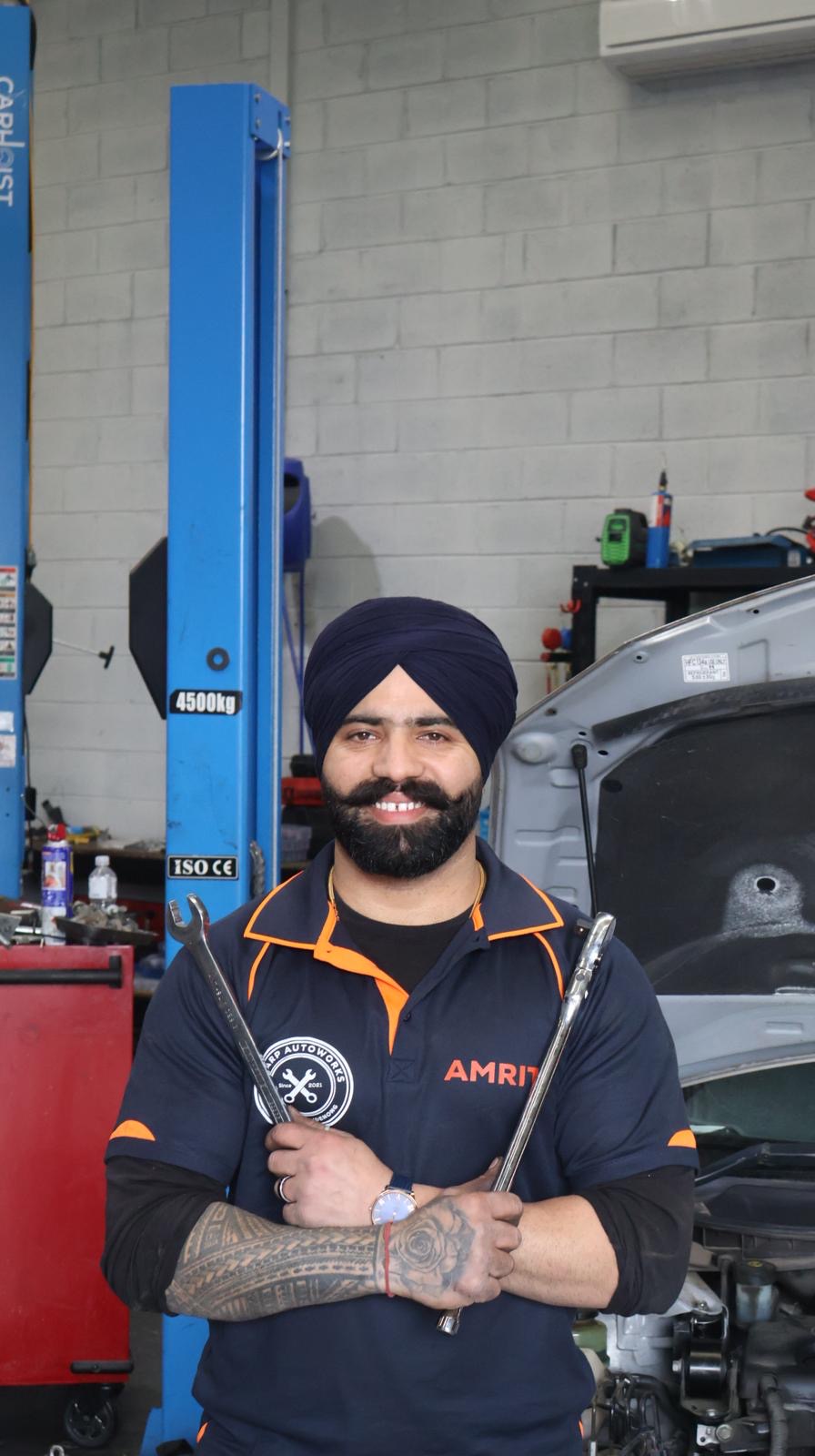 Amrit, owner of Sharp Autoworks, at the workshop