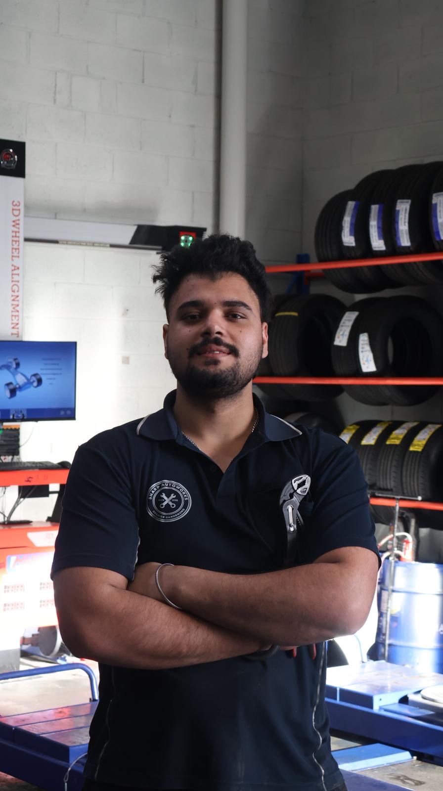 A Sharp Autoworks technician at the workshop